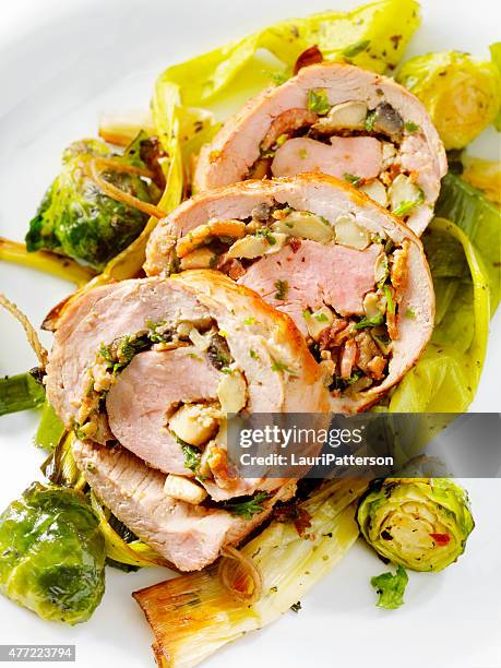 bacon and mushroom stuffed pork tenderloin - roasted garlic stock pictures, royalty-free photos & images