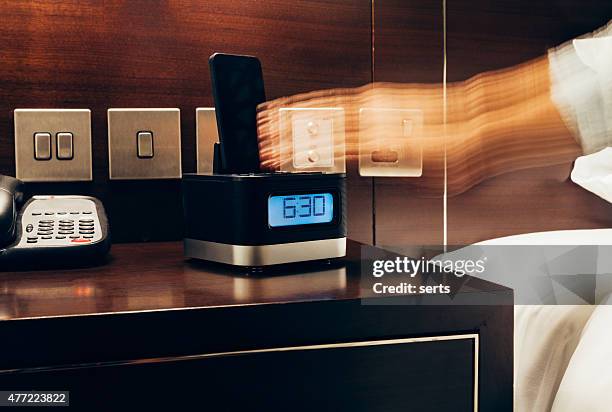 wake up early time - alarm clock hand stock pictures, royalty-free photos & images