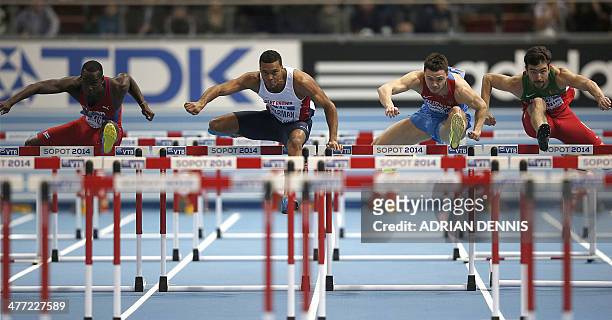 Cuba's Jhoanis Portilla, Great Britain's William Sharman, Russia's Konstantin Shabanov, Belarus' Aliaksandr Linnik compete in men's 60 metres hurdles...