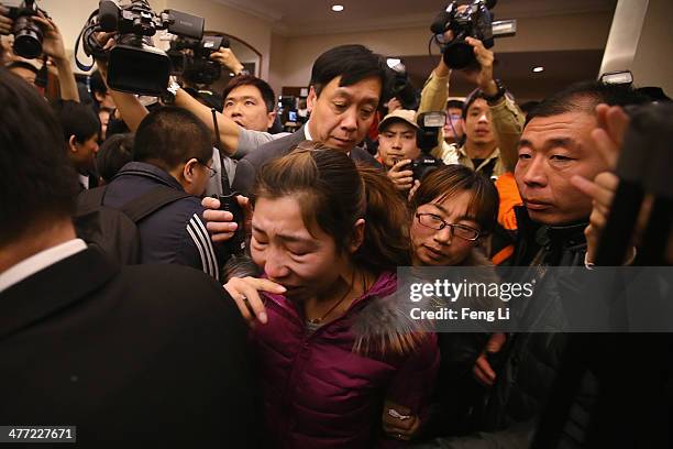 Relative of a passenger onboard Malaysia Airlines flight MH370 cries at Lidu Hotel on March 8, 2014 in Beijing, China. Malaysia Airlines Flight MH370...