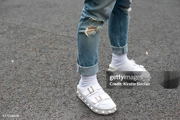 Fashion writer and consultant Yu Masui wears Ami jeans and Henrik Vibskov shoes on day 3 of London Collections: Men on June 14, 2015 in London,...