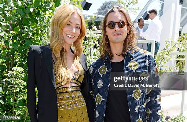 Clara Paget and Oscar Tuttiett arrive at the Burberry Menswear Spring/Summer 2016 show at Kensington Gardens on June 15, 2015 in London, England.