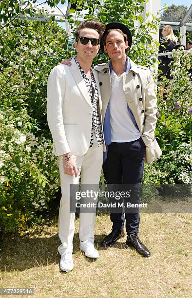 Nick Grimshaw and Sam Claflin arrive at the Burberry Menswear Spring/Summer 2016 show at Kensington Gardens on June 15, 2015 in London, England.