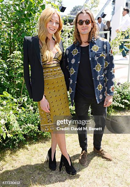 Clara Paget and Oscar Tuttiett arrive at the Burberry Menswear Spring/Summer 2016 show at Kensington Gardens on June 15, 2015 in London, England.