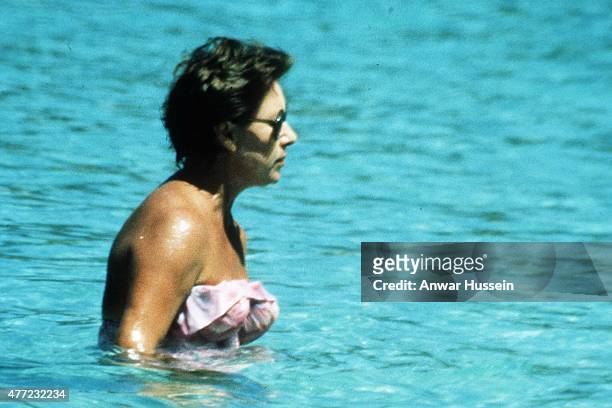 Princess Margaret swims in the sea with boyfriend Roddy Llewellyn whilst on holiday on February 01, 1976 in Mustique, West Indies.