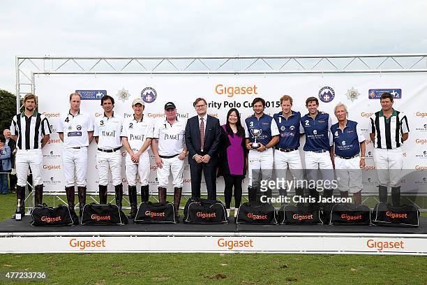 Prince William, Duke of Cambridge with team Piaget and Prince Harry with winning team Royal Salute and Charles Frankl and Jenny Pan at the Gigaset...