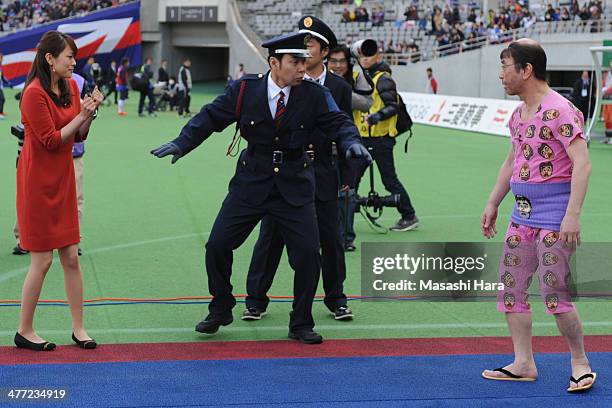 Japanese comedian Ken Shimura perfprm before the J.League match between FC Tokyo vs Ventforet Kofu at Ajinomoto Stadiuma on March 8, 2014 in Tokyo,...