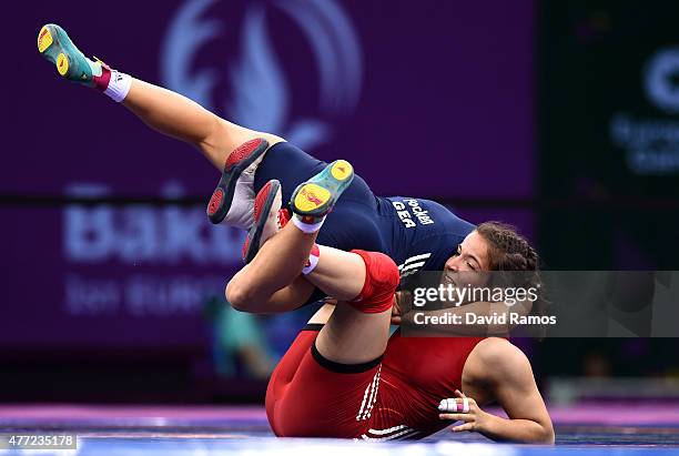 Martina Kuenz of Austria and Aline Focken of Germany compete in the Women's Freestyle 69kg Wrestling Bronze Final during day three of the Baku 2015...