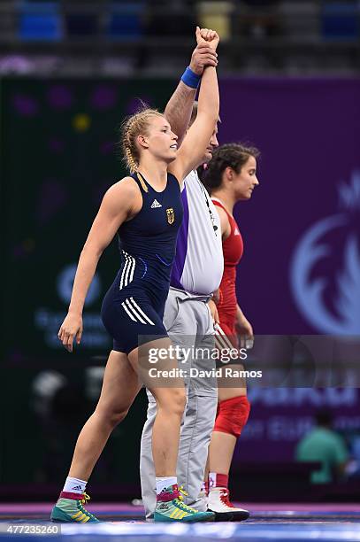 Aline Focken of Germany celebrates victory over Martina Kuenz of Austria in the Women's Freestyle 69kg Wrestling Bronze Final during day three of the...