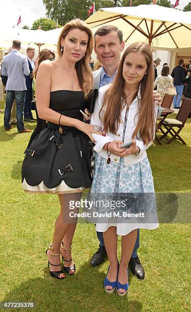 Alexandra Shishlova, Alexey Mauergauz and Nikol Mauergauz attend The Cartier Queen's Cup final at Guards Polo Club on June 14, 2015 in Egham, England.