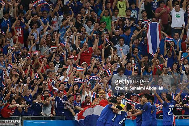 Thailand players celebrate with fans after scoring a goal in the men's gold medal football match between Thailand and Myanmar at the National Stadium...