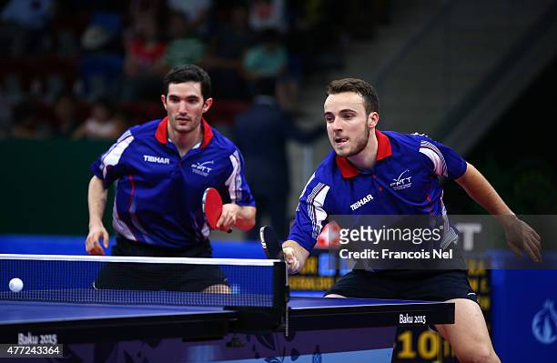 Emmanuel Lebesson and Simon Gauzy of France compete in the Mens Table Tennis Team Final against Joao Geraldo and Tiago Apolonia of Portugal during...