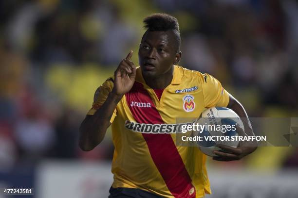 Duvier Riascos of Morelia celebrates after scoring against Pumas during their Mexican Clausura tournament football match on March 7, 2014 in Morelia,...