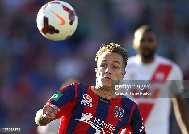 Adam Taggart of the Jets chases the ball during the round 22 A-League match between the Newcastle Jets and Melbourne Heart at Hunter Stadium on March...