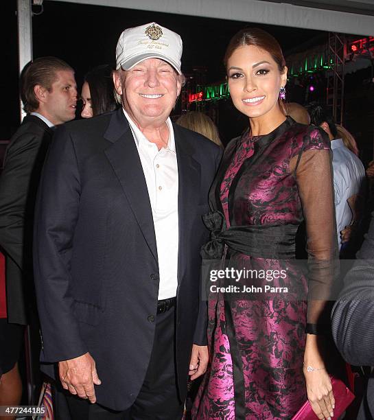 Donald Trump and Miss Universe 2013 Gabriela Isler attend the Carolina Herrera Fashion Show with GREY GOOSE Vodka at the Cadillac Championship at...