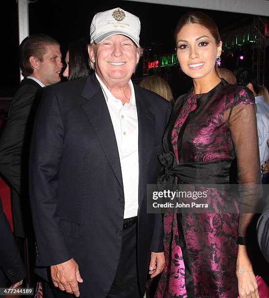 Donald Trump and Miss Universe 2013 Gabriela Isler attend the Carolina Herrera Fashion Show with GREY GOOSE Vodka at the Cadillac Championship at...