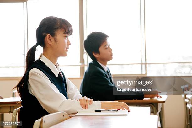 high school students, children listen to a lesson, classroom, japan - student sitting in desk side view stock pictures, royalty-free photos & images