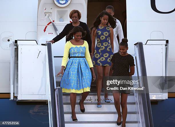 First Lady Michelle Obama arrives with daughters Malia Obama and Sasha Obama and her mother Marian Robinson at Stanstead airport on June 15, 2015 in...