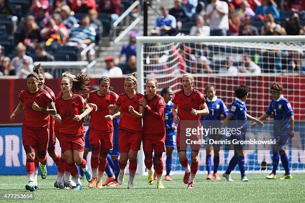 Melanie Leupolz of Germany celebrates with team mates as she scores the opening goal during the FIFA Women's World Cup Canada 2015 Group B match...