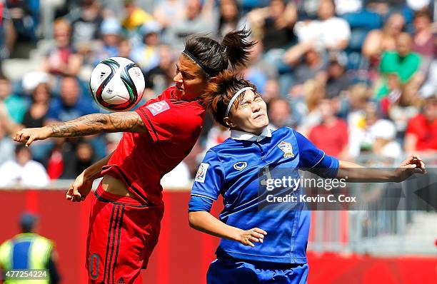 Natthakarn Chinwong of Thailand challenges Dzsenifer Marozsan of Germany during the FIFA Women's World Cup Canada 2015 match between Thailand and...