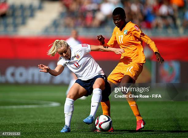 Nadege Cisse of Cote D'Ivoire challenges Lene Mykjaland of Norway during the FIFA Women's World Cup 2015 Group B match between Cote D'Ivoire and...