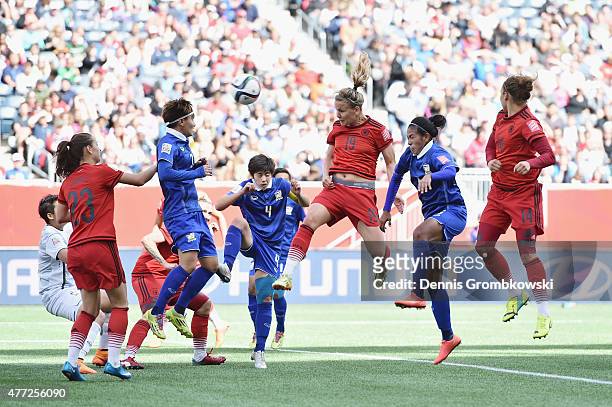 Lena Petermann of Germany heads the third goal during the FIFA Women's World Cup Canada 2015 Group B match between Thailand and Germany at Winnipeg...