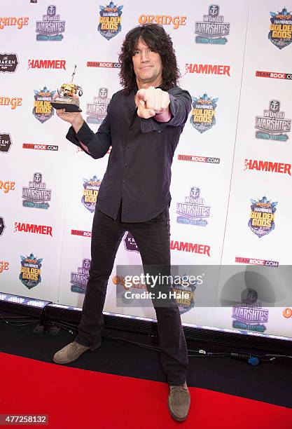 Tommy Tayer poses with the Defenders of the Faith Award for Kiss during the Metal Hammer Golden Gods Awards 2015 at Indigo2 at The O2 Arena on June...