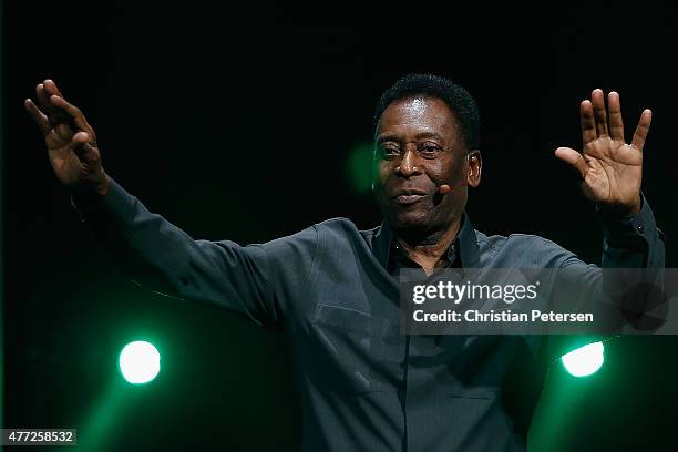 Retired Brazilian professional footballer Pele waves to fans as he leaves the Electronic Arts E3 press conference at the LA Sports Arena on June 15,...