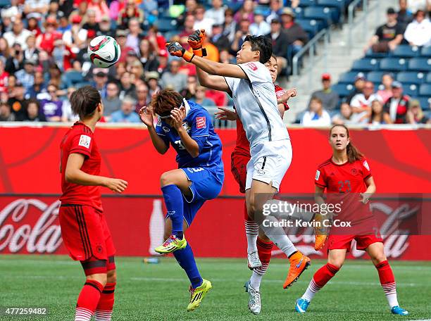 Goalkeeper Waraporn Boonsing of Thailand punches out a shot attempt against Celia Sasic of Germany during the FIFA Women's World Cup Canada 2015...