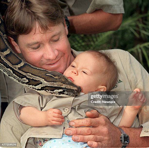 Presenter adventurer, crocodile hunter Steve Irwin with daughter Bindi Irwin and 'Bazzle' the python snake at Australia Zoo.