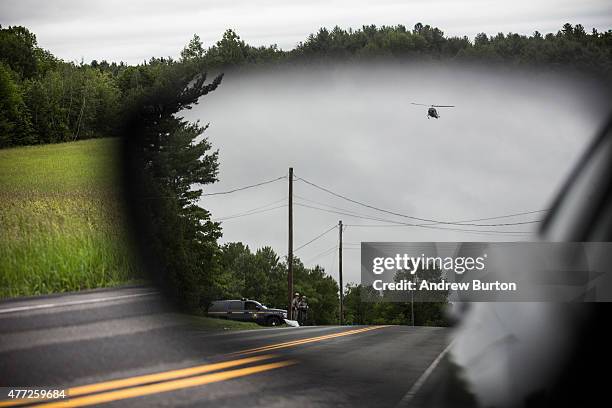 Helicopter searches for two escaped convicts on June 15, 2015 outside Dannemora, New York. The two convicted murderers escaped from Clinton...