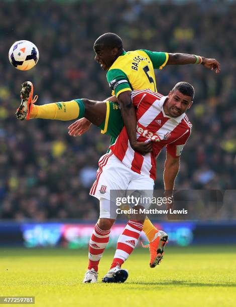 Sebastien Bassong of Norwich and Jonathan Walters of Stoke compoete for the ball during the Barclays Premier League match between Norwich and Stoke...
