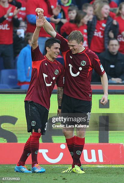 Artjomas Rudnevs of Hanover celebrates his goal with Leonardo Bittencourt during the Bundesliga match between Hannover 96 and Bayer Leverkusen at...