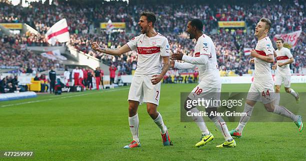 Martin Harnik of Stuttgart celebrates his team's second goal with team mates Cacau and Alexandru Maxim during the Bundesliga match between VfB...