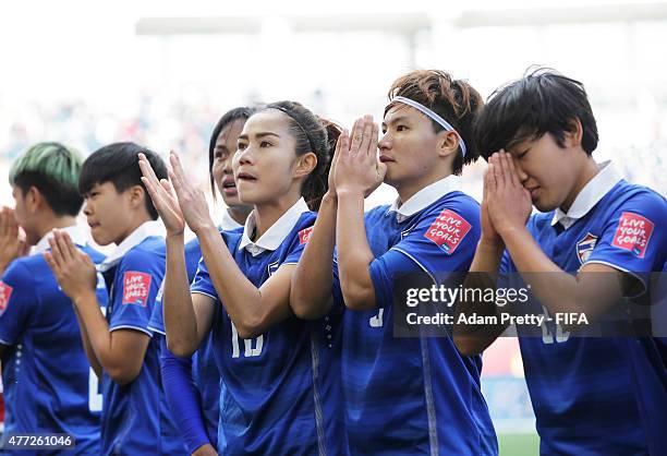 Natthakarn Chinwong of Thailand and team mates thank the fans after the FIFA Women's World Cup 2015 Group B match between Thailand and Germany at...