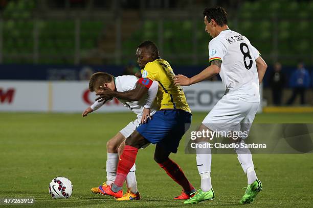 Alejandro Chumacero of Bolivia fights for the ball with Walter Ayovi of Ecuador during the 2015 Copa America Chile Group A match between Ecuador and...