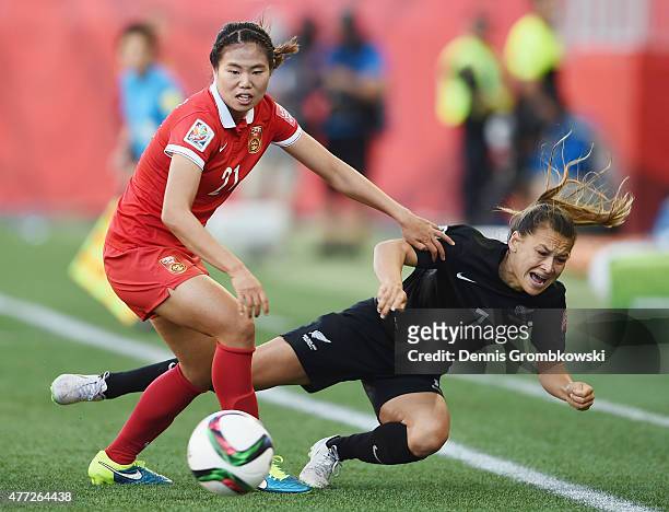 Lisi Wang of China PR challenges Ali Riley of New Zealand during the FIFA Women's World Cup Canada 2015 Group A match between China PR and New...