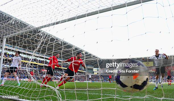 Cardiff City player Steven Caulker celebrates after scoring the opening goal during the Barclays Premier league match between Cardiff City and Fulham...