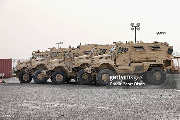 Vehicles sit in Redistribution Property Accountability Team yard at Kandahar Airfield on March 8, 2014 near Kandahar, Afghanistan. The RPAT facility...