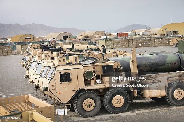 Vehicles sit in Redistribution Property Accountability Team yard at Kandahar Airfield on March 8, 2014 near Kandahar, Afghanistan. The RPAT facility...