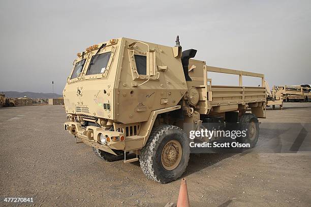 Vehicles sit in Redistribution Property Accountability Team yard at Kandahar Airfield on March 8, 2014 near Kandahar, Afghanistan. The RPAT facility...