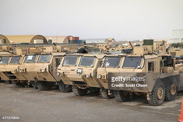 Vehicles sit in Redistribution Property Accountability Team yard at Kandahar Airfield on March 8, 2014 near Kandahar, Afghanistan. The RPAT facility...