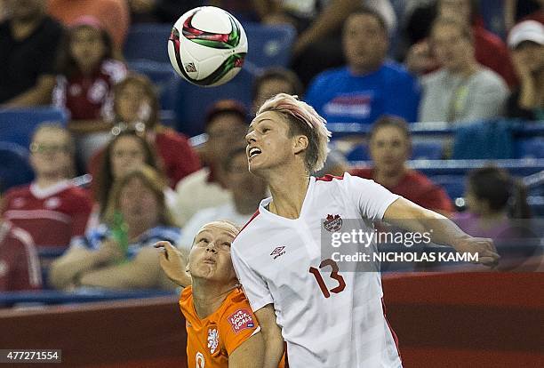 Canada's Sophie Schmidt and the Netherlands' Vivianne Miedima fight for the ball during a 2015 FIFA Women's World Cup Group A match at the Olympic...