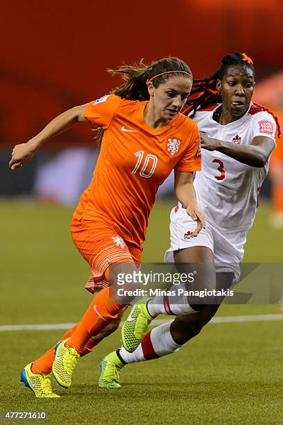 Danielle Van De Donk of the Netherlands and Kadeisha Buchanan of Canada run during the 2015 FIFA Women's World Cup Group A match at Olympic Stadium...