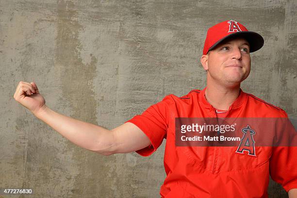 Vinnie Pestano of the Los Angeles of Anaheim poses for a portrait displaying the scar from a 2006 Tommy John surgery at Angel Stadium of Anaheim on...