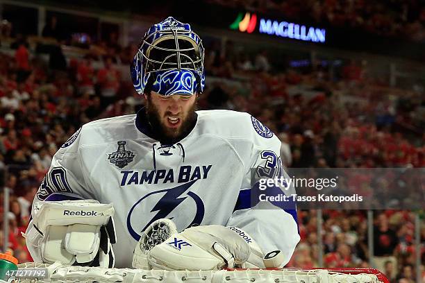 Ben Bishop of the Tampa Bay Lightning reacts after a play at the net against the Chicago Blackhawks during the second period in Game Six of the 2015...