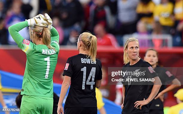 New Zealand's goalkeeper Erin Nayler and her teammates react at the end of their Group A football match of the 2015 FIFA Women's World Cup against...