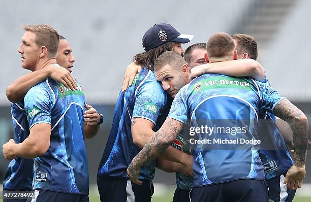 Robbie Farah and teamates perform a group hug during a New South Wales Blues State of Origin training session at the Melbourne Cricket Ground on June...