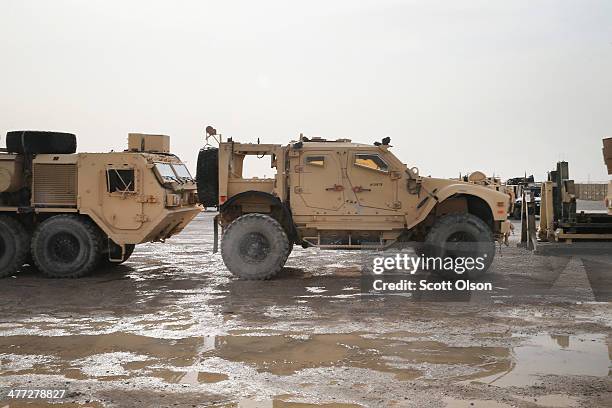 Vehicles sit in the Redistribution Property Accountability Team yard at Kandahar Airfield on March 8, 2014 near Kandahar, Afghanistan. The RPAT...