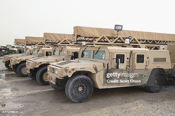 Humvees sit in the Redistribution Property Accountability Team yard at Kandahar Airfield on March 8, 2014 near Kandahar, Afghanistan. The RPAT...